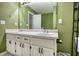 Bright bathroom featuring a double sink vanity with white cabinetry and plenty of counter space at 70 Summer Walk Dr, Covington, GA 30016