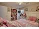 Charming bedroom with a ceiling fan, plush bedding, built in closet, and a bright window at 70 Summer Walk Dr, Covington, GA 30016