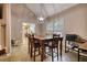 Cozy dining area with wood table and view into the kitchen at 70 Summer Walk Dr, Covington, GA 30016