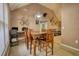 Dining area with vaulted ceiling and view to living room at 70 Summer Walk Dr, Covington, GA 30016