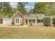 One-story home with two car garage, a bay window, covered porch and well maintained lawn at 70 Summer Walk Dr, Covington, GA 30016