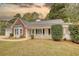 Charming single-story home with a welcoming front porch and well-manicured landscaping at 70 Summer Walk Dr, Covington, GA 30016