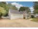 One-story home with two car garage, long drive, bay window, covered porch and manicured lawn at 70 Summer Walk Dr, Covington, GA 30016