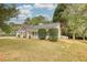 Charming one-story home with manicured lawn, covered porch and black shuttered windows at 70 Summer Walk Dr, Covington, GA 30016