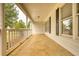 Inviting covered front porch with white railings and ample space for relaxing at 70 Summer Walk Dr, Covington, GA 30016