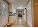 Hallway with white cabinets, hardwood floors, and a dining room in the background at 70 Summer Walk Dr, Covington, GA 30016