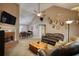 Spacious living room with a brick fireplace, vaulted ceiling, and ample seating at 70 Summer Walk Dr, Covington, GA 30016