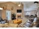 Cozy living room features vaulted ceilings, brick fireplace and open to dining area at 70 Summer Walk Dr, Covington, GA 30016