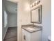 Bathroom with granite countertop vanity and view into additional room at 1718 Country Park Way, Lawrenceville, GA 30043