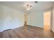 Bedroom with wood-look flooring, ceiling fan, and multiple closets for ample storage space at 1718 Country Park Way, Lawrenceville, GA 30043