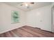 Bedroom with wood floor, closet and bright window at 1718 Country Park Way, Lawrenceville, GA 30043