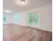 Large bonus room with natural light and access to the outdoor space at 1718 Country Park Way, Lawrenceville, GA 30043