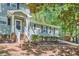Charming front entrance with brick steps, white railings, and tidy landscaping at 1718 Country Park Way, Lawrenceville, GA 30043