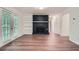 Spacious living room with wood flooring, a decorative fireplace, and access to the outdoor space at 1718 Country Park Way, Lawrenceville, GA 30043