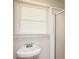 Second bathroom featuring pedestal sink, stand-up shower, and window with blinds at 2179 Jernigan Drive Se Dr, Atlanta, GA 30315