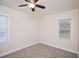 Bedroom featuring neutral carpet, ceiling fan, and two large windows with blinds at 2179 Jernigan Drive Se Dr, Atlanta, GA 30315