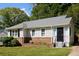 Charming single-story home with well-maintained lawn, brick facade, and new gray roof at 2179 Jernigan Drive Se Dr, Atlanta, GA 30315