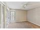 Bedroom featuring a ceiling fan, built-in shelving unit, and window with blinds at 23101 Plantation Ne Dr, Atlanta, GA 30324