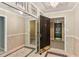A view inside the condo from the front door, showcasing tile floors and mirrors at 23101 Plantation Ne Dr, Atlanta, GA 30324
