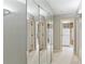 Hallway with mirrored closet doors reflecting additional closet space at 23101 Plantation Ne Dr, Atlanta, GA 30324