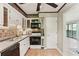 Well-lit kitchen with classic white cabinets, subway tile backsplash, and modern appliances at 23101 Plantation Ne Dr, Atlanta, GA 30324