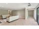 The living room features tile floors, white sofas, and access to other rooms in the unit at 23101 Plantation Ne Dr, Atlanta, GA 30324