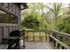Enjoy outdoor cooking on the back deck with grill, benches and a wooded backyard view at 4727 Emily Sw Dr, Lilburn, GA 30047
