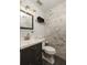 Updated bathroom featuring modern vanity, stylish fixtures, and tiled walls at 4727 Emily Sw Dr, Lilburn, GA 30047