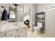 Bathroom features a classic vanity and view to adjacent rooms and natural lighting at 4727 Emily Sw Dr, Lilburn, GA 30047