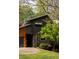 Beautiful home featuring unique wood siding and lovely landscaping at 4727 Emily Sw Dr, Lilburn, GA 30047