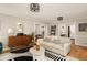Spacious living room with hardwood floors, modern furniture, and ample natural light at 4727 Emily Sw Dr, Lilburn, GA 30047