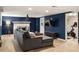 Finished basement living room offers a cozy fireplace and leads to workout area at 4727 Emily Sw Dr, Lilburn, GA 30047