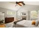 Spacious main bedroom with vaulted ceiling, private balcony, fireplace, and ample natural light at 4727 Emily Sw Dr, Lilburn, GA 30047