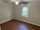Cozy bedroom with wood-look flooring and a window providing natural light at 6334 Forester Way, Lithonia, GA 30038