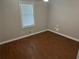 Comfortable bedroom with wood-look flooring and ample natural light at 6334 Forester Way, Lithonia, GA 30038