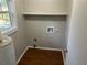 Dedicated laundry room with washer/dryer hookups and overhead shelving at 6334 Forester Way, Lithonia, GA 30038
