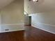 Spacious living room with high ceilings, wood-look flooring, and neutral paint at 6334 Forester Way, Lithonia, GA 30038