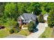 Beautifully landscaped property with mature trees and a long driveway on a large lot at 844 Nob Ridge Dr, Marietta, GA 30064