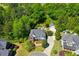 Aerial view of home showcasing mature trees, expansive backyard, and detached garage on a private lot at 844 Nob Ridge Dr, Marietta, GA 30064