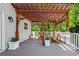 This wooden back deck is perfect for outdoor entertaining with shade from the pergola and privacy from the trees at 844 Nob Ridge Dr, Marietta, GA 30064