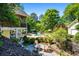 Beautiful backyard with pool, seating area, and manicured landscaping at 844 Nob Ridge Dr, Marietta, GA 30064