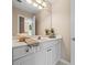 Bright bathroom features a white vanity with a large mirror and decorative accents at 844 Nob Ridge Dr, Marietta, GA 30064