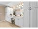 Luxurious primary bath with dual vanities, elegant lighting, and ample storage at 844 Nob Ridge Dr, Marietta, GA 30064
