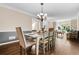 Elegant dining room with hardwood floors, neutral paint, crown molding, and a charming chandelier at 844 Nob Ridge Dr, Marietta, GA 30064