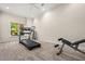 A dedicated exercise room features a treadmill, weights, natural light, and plenty of space to work out at 844 Nob Ridge Dr, Marietta, GA 30064