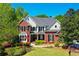 Charming two-story home with a manicured lawn and mature landscaping, perfect for families at 844 Nob Ridge Dr, Marietta, GA 30064