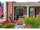 Elegant front entrance with brick facade, decorative columns, and a landscaped walkway for guests at 844 Nob Ridge Dr, Marietta, GA 30064