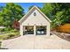 Detached two-car garage with lift and storage, perfect for car enthusiasts at 844 Nob Ridge Dr, Marietta, GA 30064