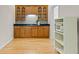 A beautiful kitchenette offers wooden cabinets, a black countertop, and a microwave for added convenience at 844 Nob Ridge Dr, Marietta, GA 30064