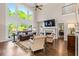Spacious living room with soaring ceilings, expansive windows, and cozy fireplace at 844 Nob Ridge Dr, Marietta, GA 30064